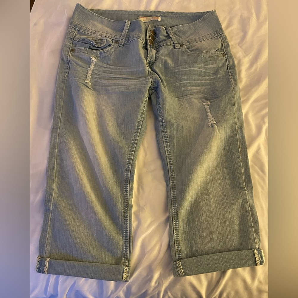 Light blue denim capris with sparkles on the back pockets